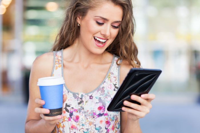 21462379_l-Woman-with-digital-tablet-and-coffee-e1753950888124